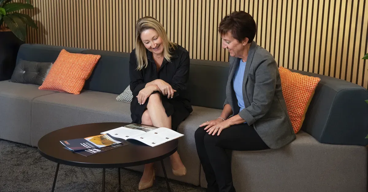  PMG Pmg staff talking to investor 